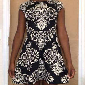 Black and gold mid length dress